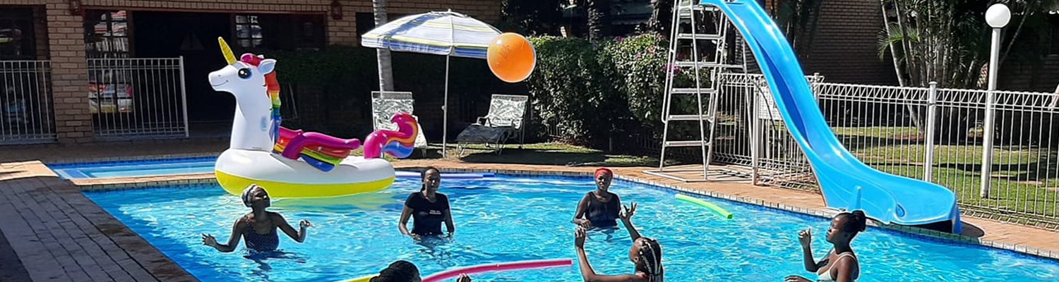 Heated swimming pool at Hoogland Spa Resort, self catering in Bela bela